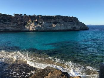 Scenic view of sea against blue sky