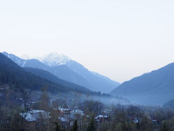 Scenic view of snowcapped mountains against sky