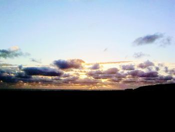 Scenic view of silhouette landscape against sky during sunset