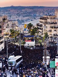 High angle view of people on street amidst buildings in city