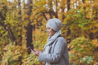 Man using mobile phone in park