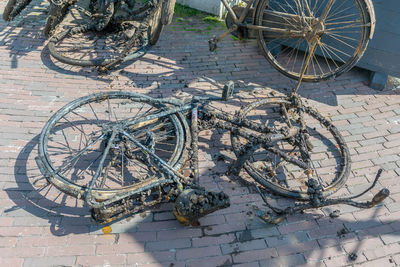 High angle view of bicycle parked on footpath