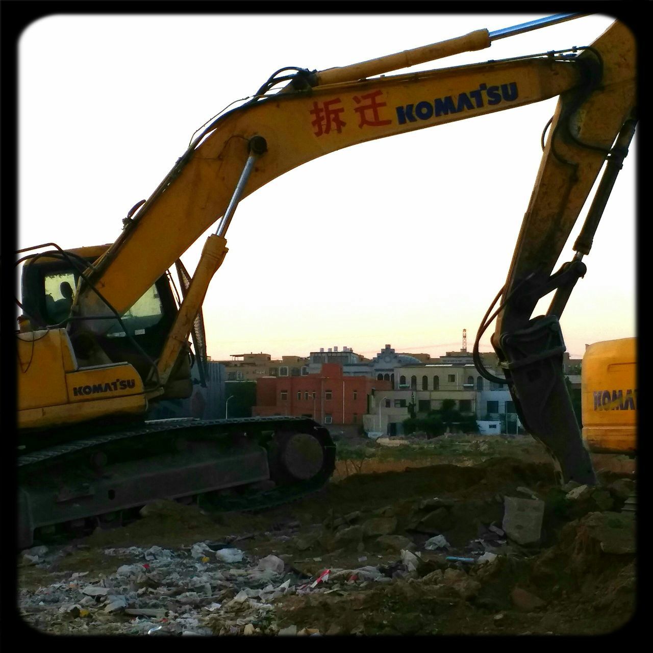 earth mover, construction site, construction machinery, built structure, outdoors, industry, day, no people, architecture, building exterior, sky