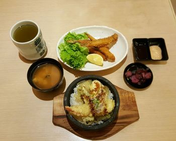 High angle view of serving food served on table