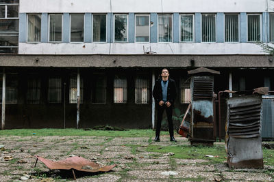 Full length portrait of man standing outdoors