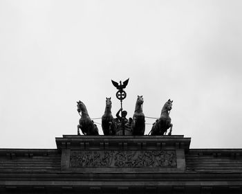 Low angle view of statue against sky