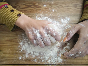 High angle view of person preparing food on table