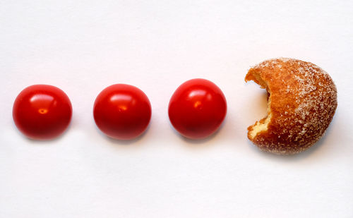 Close-up of tomatoes against white background