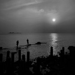 Scenic view of sea against sky at sunset