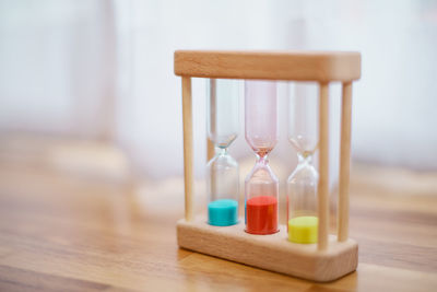 Close-up of hourglass on table