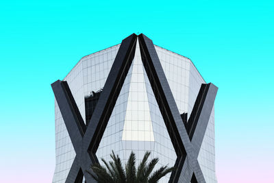 Low angle view of modern building against clear blue sky