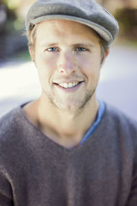Portrait of smiling man wearing flat cap