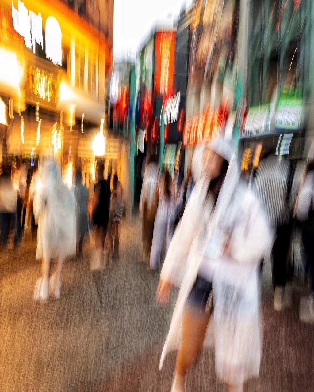 CROWD WALKING ON STREET IN CITY