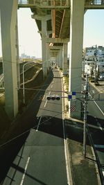 Cars on bridge against sky