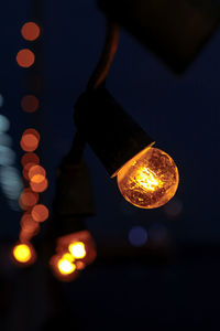 Close-up of illuminated light bulb