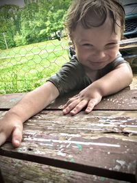 Portrait of boy playing on table