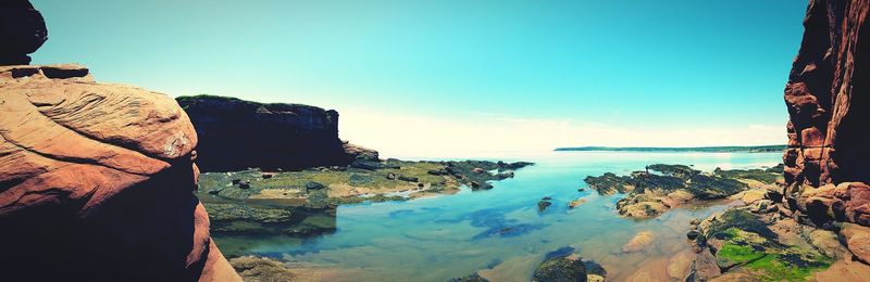 Scenic view of sea against blue sky
