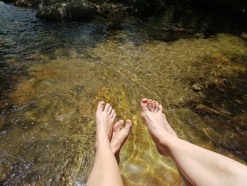 Low section of women over water