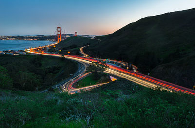 High angle view of light trails on road in city