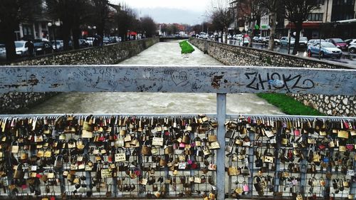 Padlocks on footbridge in city