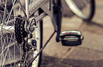 Close-up of bicycle on cobbled street