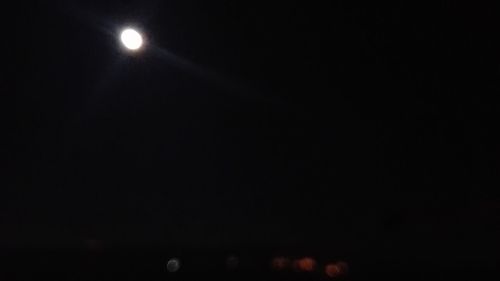 Illuminated moon in sky at night