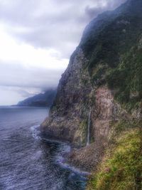 Close-up of sea against mountain