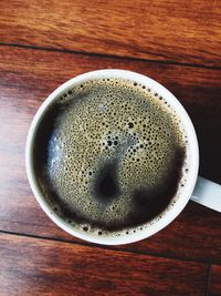 High angle view of coffee cup on table