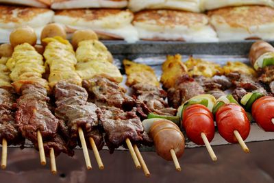 Close-up of meat on barbecue grill at street market