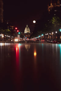 Illuminated buildings in city at night