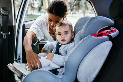 Rear view of men sitting in car