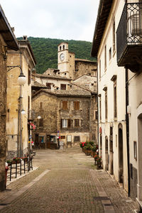 Footpath amidst buildings in town