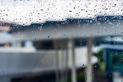 Full frame shot of wet window in rainy season