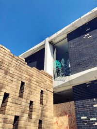 Low angle view of building against blue sky