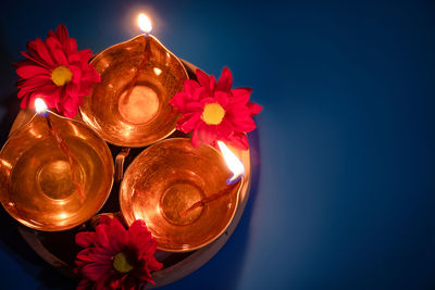 Close-up of christmas decorations against blue background