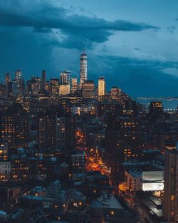 Illuminated cityscape against sky