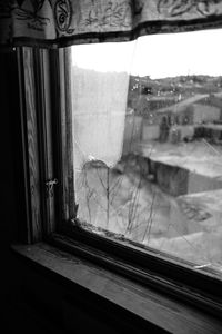 Close-up of glass window of house