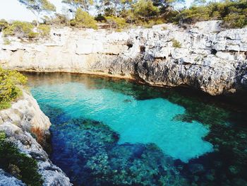 High angle view of rocks by sea