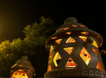 Low angle view of illuminated statue at night