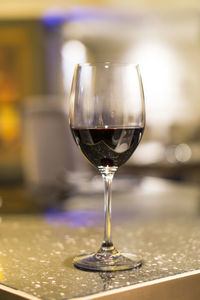 Close-up of wineglass on table