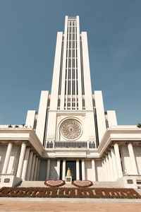 Low angle view of clock tower against clear sky
