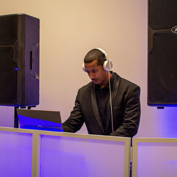 Front view of male djing a party 