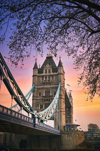 Low angle view of bridge against sky during sunset