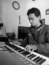 Young man playing piano