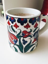 Close-up of coffee cup on table