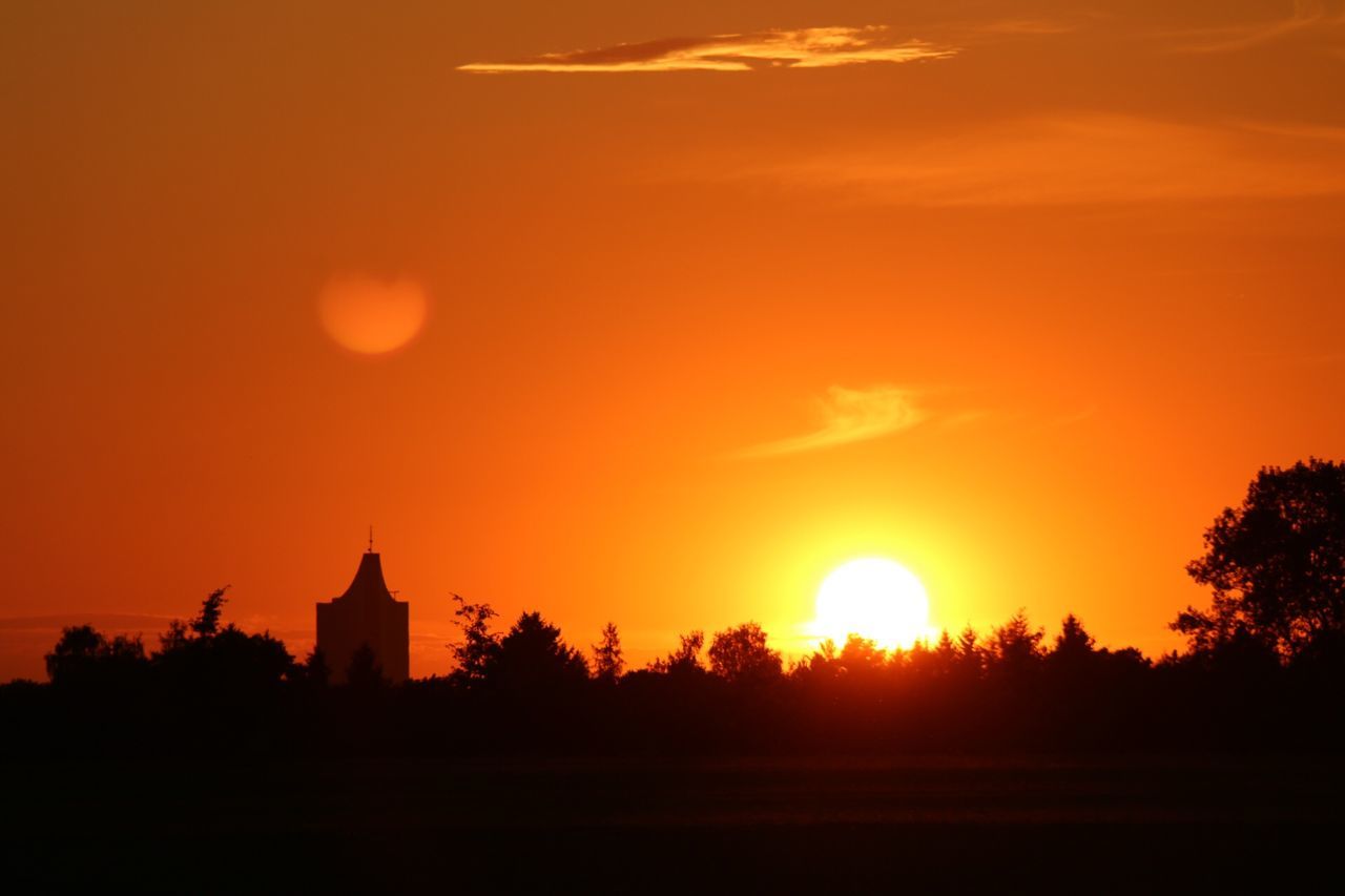 sunset, orange color, silhouette, sun, architecture, built structure, sky, beauty in nature, building exterior, scenics, tranquil scene, tranquility, idyllic, nature, tree, sunlight, outdoors, no people, cloud - sky, dramatic sky