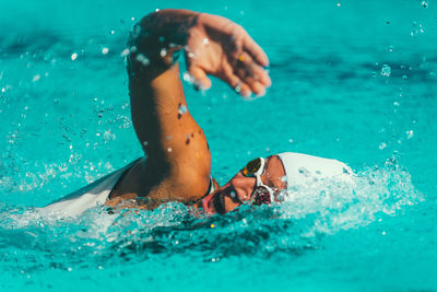 Female athlete swimming in pool