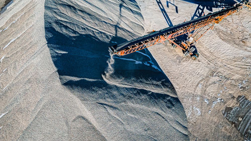 Freshly crushed gravel being dropped by conveyor 