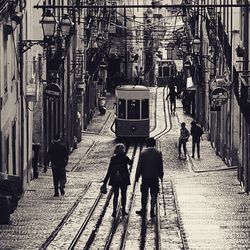 People walking on street in city