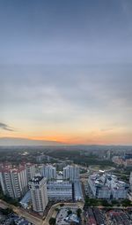 High angle view of buildings against sky during sunset